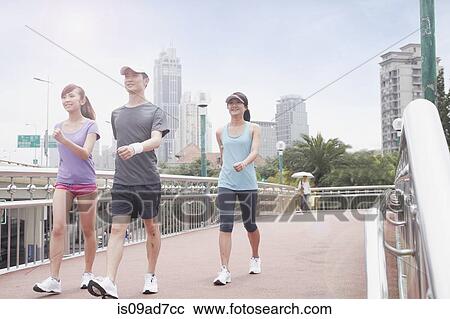 Young people walking in Shanghai, China View Large Photo Image Stock Image - Young people walking in Shanghai, China. Fotosearch