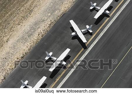 Stock Photography - Aerial view of four airplanes on runway, St Kilda, Melbourne, Victoria, Australia. Fotosearch