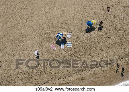 Stock Image - Aerial view of holiday makers on beach, Melbourne, Victoria, Australia. Fotosearch