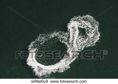 Aerial view of jet skier making figure of eight at sea, Melbourne, Victoria, Australia View Large Photo Image Stock Photo - Aerial view of jet skier making figure of eight at sea, Melbourne, Victoria, Australia. Fotosearch