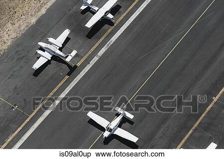 Stock Photography - Aerial view of three airplanes on runway, St Kilda, Melbourne, Victoria, Australia. Fotosearch