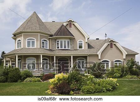 Beige with white trim cottage style house facade, Quebec, Canada View Large Photo Image Stock Photography - Beige with white trim cottage style house facade, Quebec, Canada. Fotosearch