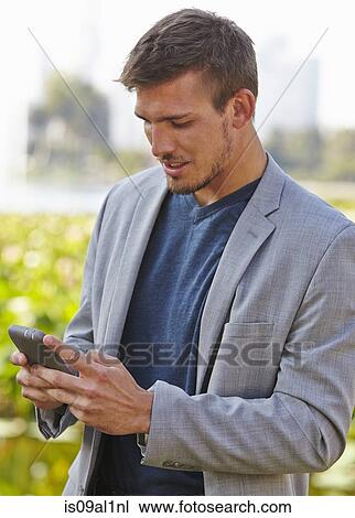 Businessman using smartphone View Large Photo Image Stock Image - Businessman using smartphone. Fotosearch