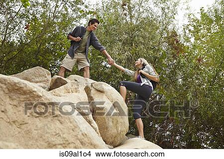 Couple rock climbing View Large Photo Image Picture - Couple rock climbing. Fotosearch