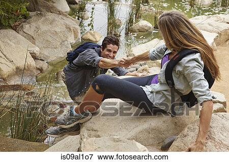 Couple rock climbing View Large Photo Image Stock Photo - Couple rock climbing. Fotosearch