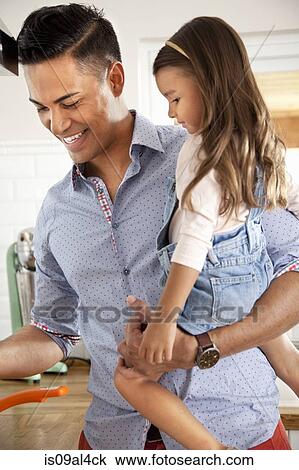 Father holding daughter View Large Photo Image Stock Image - Father holding daughter. Fotosearch