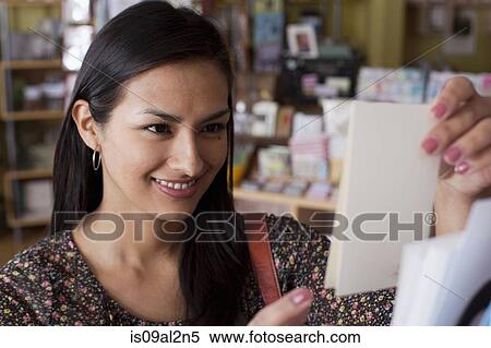 Female customer selecting greetings card in stationery shop View Large Photo Image Stock Photography - Female customer selecting greetings card in stationery shop. Fotosearch