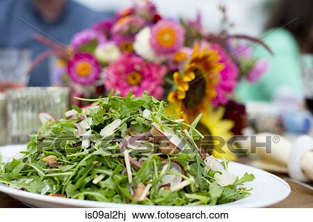 Stock Image - Fresh salad on serving plate, ready to be served. Fotosearch
