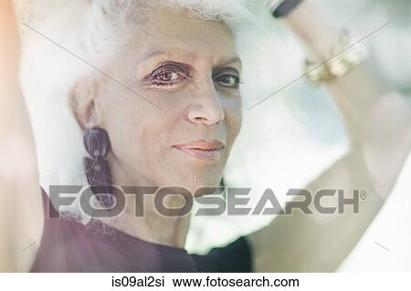 Gray haired woman smiling with confidence View Large Photo Image Stock Image - Gray haired woman smiling with confidence. Fotosearch