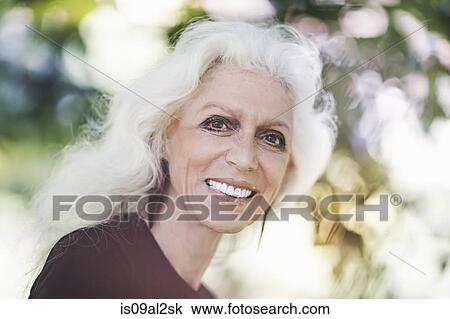 Gray haired woman smiling with confidence View Large Photo Image Stock Image - Gray haired woman smiling with confidence. Fotosearch
