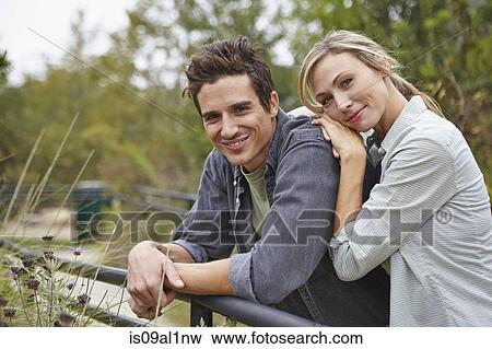 Happy couple in park View Large Photo Image Stock Photo - Happy couple in park. Fotosearch