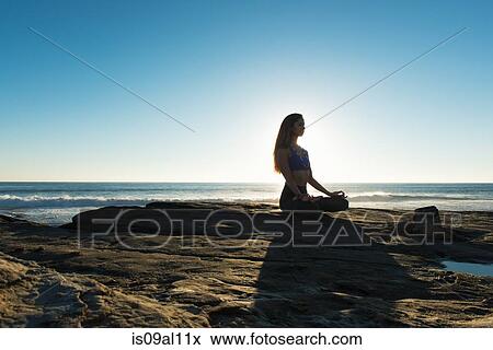 Stock Photo - Lotus pose, Windansea beach, La Jolla, California. Fotosearch