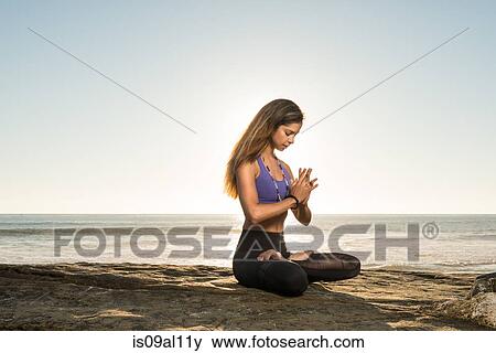 Stock Photo - Lotus pose, Windansea beach, La Jolla, California. Fotosearch
