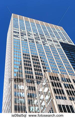 Stock Image - Low angled view of office building in financial district, Manhattan, New York, USA. Fotosearch