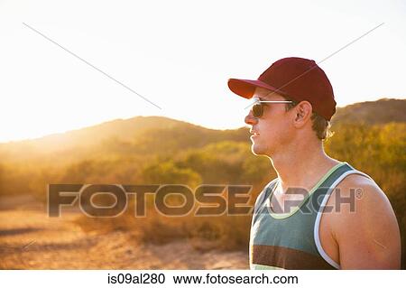 Male jogger in sunglasses and baseball cap, Poway, CA, USA View Large Photo Image Stock Image - Male jogger in sunglasses and baseball cap, Poway, CA, USA. Fotosearch