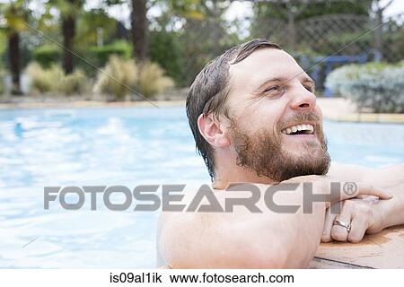 Man leaning on edge of pool View Large Photo Image Stock Image - Man leaning on edge of pool. Fotosearch