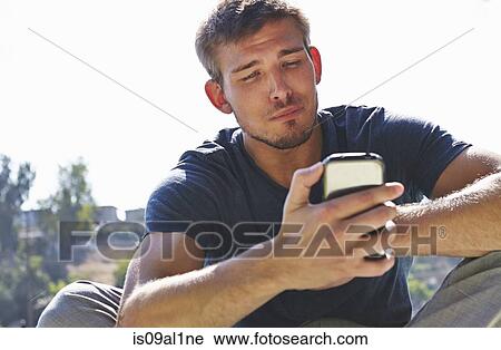 Man using smartphone View Large Photo Image Stock Image - Man using smartphone. Fotosearch