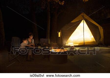 Mature woman and two sons watching campfire at night, County Park, Los Angeles, California, USA View Large Photo Image Stock Image - Mature woman and two sons watching campfire at night, County Park, Los Angeles, California, USA. Fotosearch