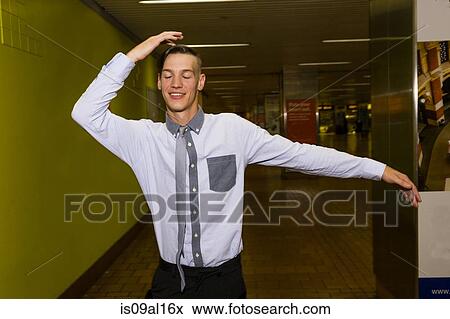 Portrait of young man dancing in subway station View Large Photo Image Stock Photo - Portrait of young man dancing in subway station. Fotosearch