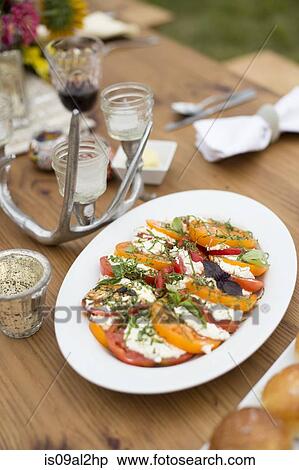 Stock Photography - Prepared salad dish on dinner table. Fotosearch