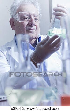 Senior scientist working at laboratory View Large Photo Image Stock Photograph - Senior scientist working at laboratory. Fotosearch