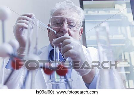 Stock Photograph - Senior scientist working at laboratory. Fotosearch
