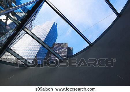 Stock Image - Skyscrapers from curved window in financial district, Manhattan, New York, USA. Fotosearch