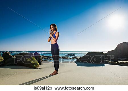 Stock Image - Standing at attention - samasthiti, Windansea beach, La Jolla, California. Fotosearch