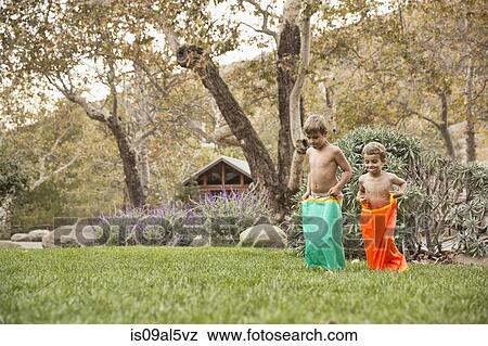 Two brothers having a sack race, County Park, Los Angeles, California, USA View Large Photo Image Stock Photo - Two brothers having a sack race, County Park, Los Angeles, California, USA. Fotosearch
