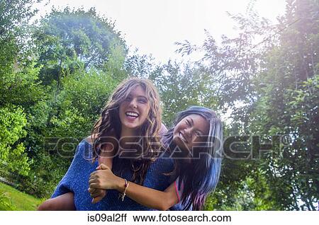 Two teenagers dancing messing around, outdoors View Large Photo Image Stock Image - Two teenagers dancing messing around, outdoors. Fotosearch