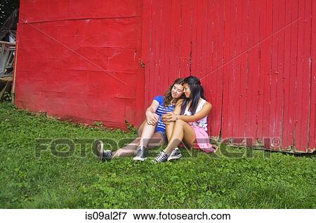 Two teenagers relaxing outdoors View Large Photo Image Stock Photo - Two teenagers relaxing outdoors. Fotosearch