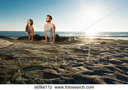 Stock Photo - Upward dog yoga pose, Windansea beach, La Jolla, California. Fotosearch