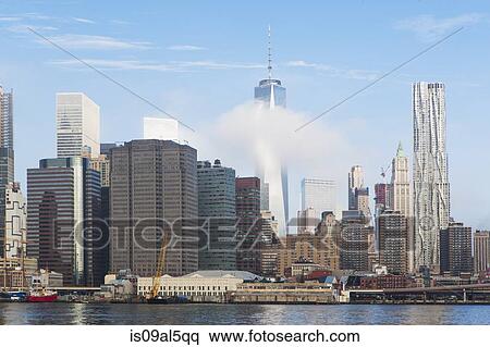 Stock Photography - View of East river and Lower Manhattan, New York, USA. Fotosearch