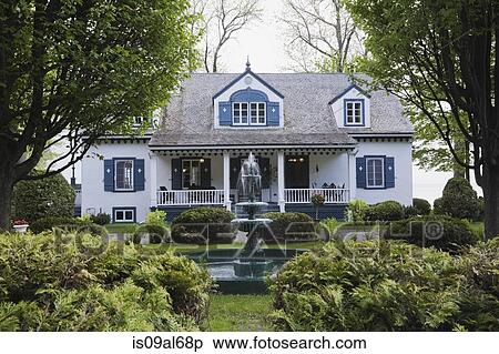 White with blue trim 1920s cottage style house facade with water fountain, Quebec, Canada View Large Photo Image Stock Photography - White with blue trim 1920s cottage style house facade with water fountain, Quebec, Canada. Fotosearch