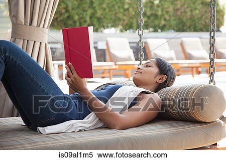 Woman reading book at home View Large Photo Image Stock Photography - Woman reading book at home. Fotosearch