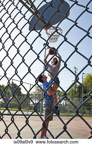 Young couple playing basketball View Large Photo Image Stock Photo - Young couple playing basketball. Fotosearch