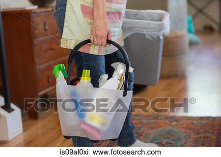 Young woman cleaning home with green cleaning products View Large Photo Image Stock Image - Young woman cleaning home with green cleaning products. Fotosearch