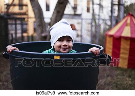 Stock Photo - Boy inside tub, Brooklyn, New York, USA. Fotosearch