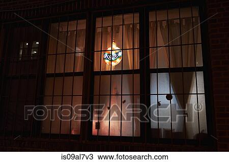 Stock Image - Christmas bauble seen through window. Fotosearch