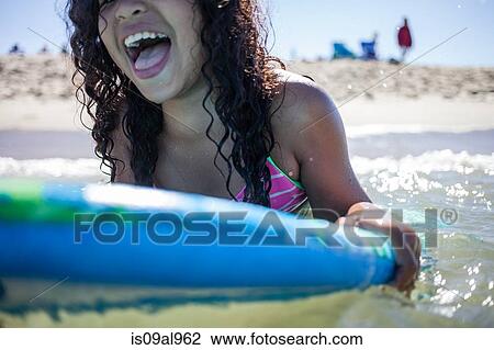 Close up of girl playing on bodyboard, Truro, Massachusetts, Cape Cod, USA View Large Photo Image Stock Image - Close up of girl playing on bodyboard, Truro, Massachusetts, Cape Cod, USA. Fotosearch
