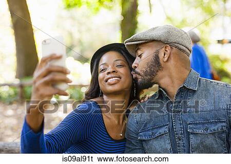 Couple taking selfie View Large Photo Image Stock Photograph - Couple taking selfie. Fotosearch