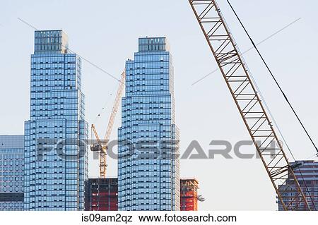 Cranes and buildings, New York, USA View Large Photo Image Stock Photo - Cranes and buildings, New York, USA. Fotosearch