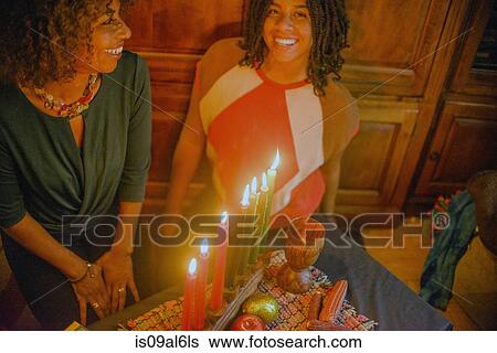 Stock Photograph - Family celebrating Kwanzaa. Fotosearch