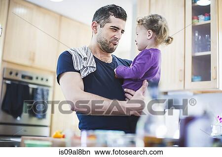 Father and daughter playing in kitchen View Large Photo Image Picture - Father and daughter playing in kitchen. Fotosearch