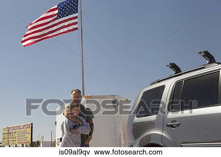 Father hugging teenage son, Continental Divide, Lordsburg, New Mexico, USA View Large Photo Image Stock Photo - Father hugging teenage son, Continental Divide, Lordsburg, New Mexico, USA. Fotosearch