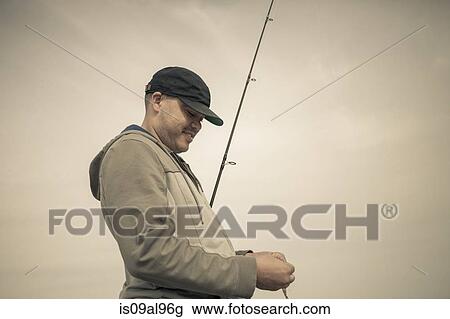 Fisherman preparing fishing rod, Truro, Massachusetts, Cape Cod, USA View Large Photo Image Stock Image - Fisherman preparing fishing rod, Truro, Massachusetts, Cape Cod, USA. Fotosearch