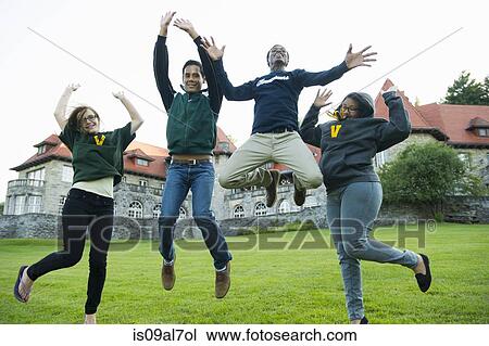 Four friends jumping mid air View Large Photo Image Stock Image - Four friends jumping mid air. Fotosearch