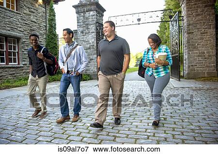 Stock Photo - Four students walking together. Fotosearch