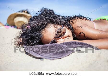 Girl sunbathing on beach, Truro, Massachusetts, Cape Cod, USA View Large Photo Image Stock Photo - Girl sunbathing on beach, Truro, Massachusetts, Cape Cod, USA. Fotosearch