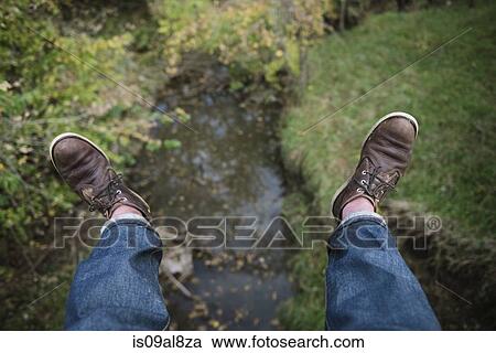 High angle view of male hikers feet above river View Large Photo Image Stock Image - High angle view of male hikers feet above river. Fotosearch